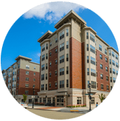 A picture of an apartment building in the daytime.