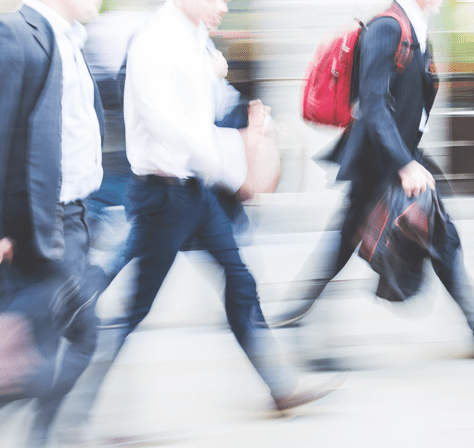 A group of people walking down the street.